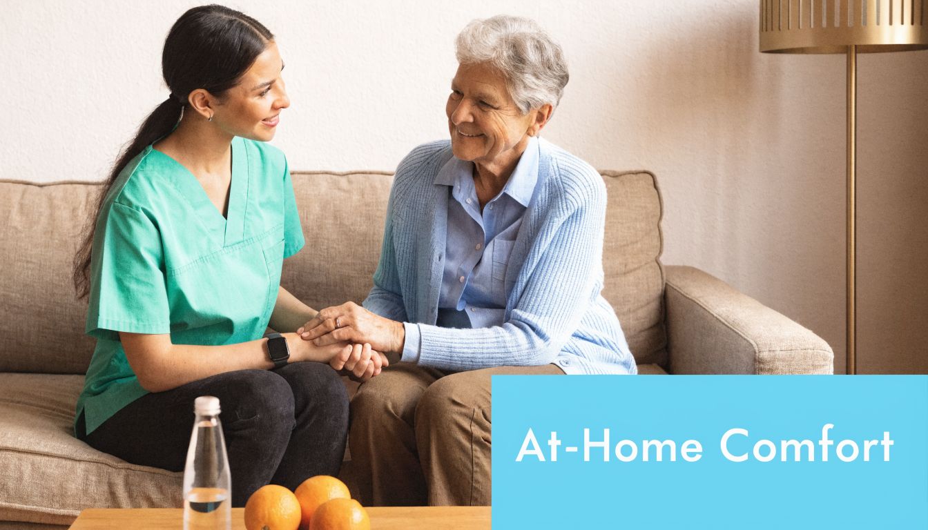 A friendly caregiver holding hands with an elderly woman in a comfortable, bright living room setting.